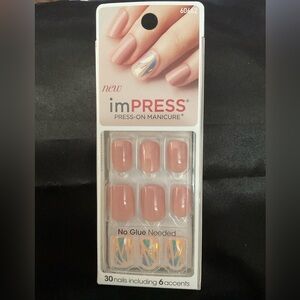 Kiss imPRESS Press-On Manicure nails.